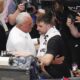 Sasa Doncic, center left in white, hugs his son, Los Angeles Lakers' Luka Doncic, center right, after the team's NBA basketball game against the Dallas Mavericks in Dallas, Wednesday, April 9, 2025. (AP Photo/Julio Cortez)