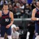Los Angeles Clippers guard Bogdan Bogdanovic, left, and center Ivica Zubac smile after he scored during the second half of an NBA basketball game against the Houston Rockets, Wednesday, April 9, 2025, in Inglewood, Calif. (AP Photo/Mark J. Terrill)