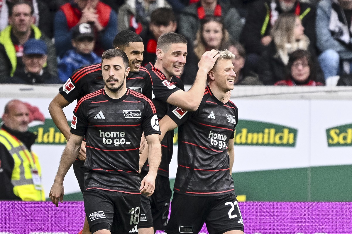 From left: Berlin's Andrej Ilic, Danilho Doekhi, Andrej Ilic and Tim Skarke celebrate after scoring their side's second goal during the German Bundesliga soccer match between SC Freiburg - 1. FC Union Berlin at The Europa-Park Stadion in Freiburg, Germany, Sunday, March 30, 2025. (Harry Langer/dpa via AP)