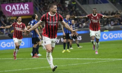 AC Milan's Luka Jovic celebrates after scoring during the Italian Cup semifinal second leg soccer match between Inter Milan and AC Milan at the San Siro stadium in Milan, Italy, Wednesday, April 23, 2025. (AP Photo/Luca Bruno)