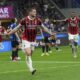 AC Milan's Luka Jovic celebrates after scoring during the Italian Cup semifinal second leg soccer match between Inter Milan and AC Milan at the San Siro stadium in Milan, Italy, Wednesday, April 23, 2025. (AP Photo/Luca Bruno)