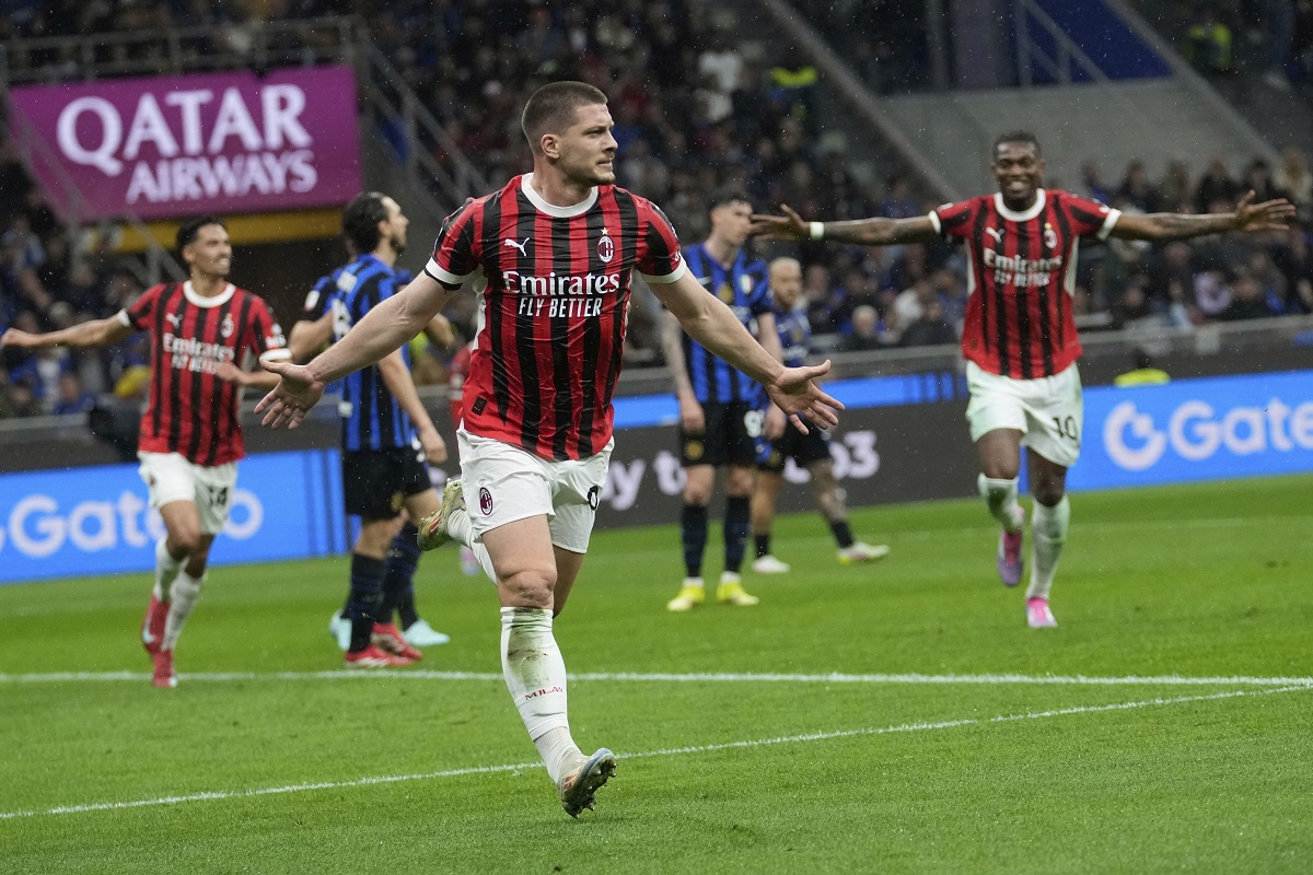 AC Milan's Luka Jovic celebrates after scoring during the Italian Cup semifinal second leg soccer match between Inter Milan and AC Milan at the San Siro stadium in Milan, Italy, Wednesday, April 23, 2025. (AP Photo/Luca Bruno)