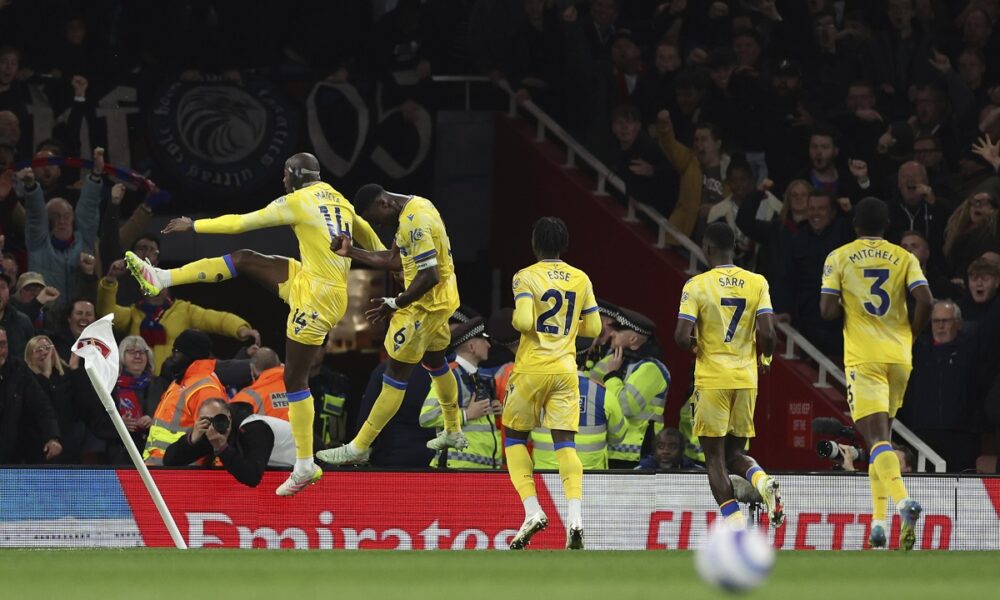 Crystal Palace's Jean-Philippe Mateta, left, celebrates with teammates after scoring his sides second goal during the English Premier League soccer match between Arsenal and Crystal Palace at Emirates stadium in London, Wednesday, April 23, 2025. (AP Photo/Ian Walton)