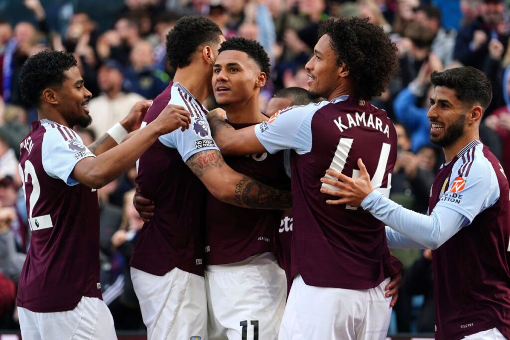 Aston Villa's Ollie Watkins, center, celebrates scoring with teammates during the English Premier League soccer match between Aston Villa and Newcastle United at Villa Park, Birmingham, England, Saturday April 19, 2025. (David Davies/PA via AP)