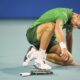 Novak Djokovic, of Serbia, gets up after collapsing on the court, as he plays Jakub Mensik, of Czech Republic, in the men's singles final match at the Miami Open tennis tournament, Sunday, March 30, 2025, in Miami Gardens, Fla. (AP Photo/Rebecca Blackwell)