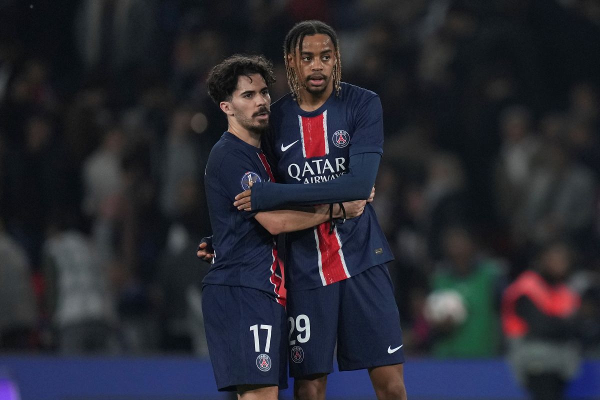 PSG's Vitinha, left, and Bradley Barcola stand. dejected after the League One soccer match between PSG and Nice in Paris Friday, April 25, 2025. (AP Photo/Thibault Camus)