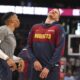 Denver Nuggets guard Russell Westbrook, left, jokes with center Nikola Jokic, right, before an NBA basketball game against the Memphis Grizzlies, Friday, April 11, 2025, in Denver. (AP Photo/David Zalubowski)