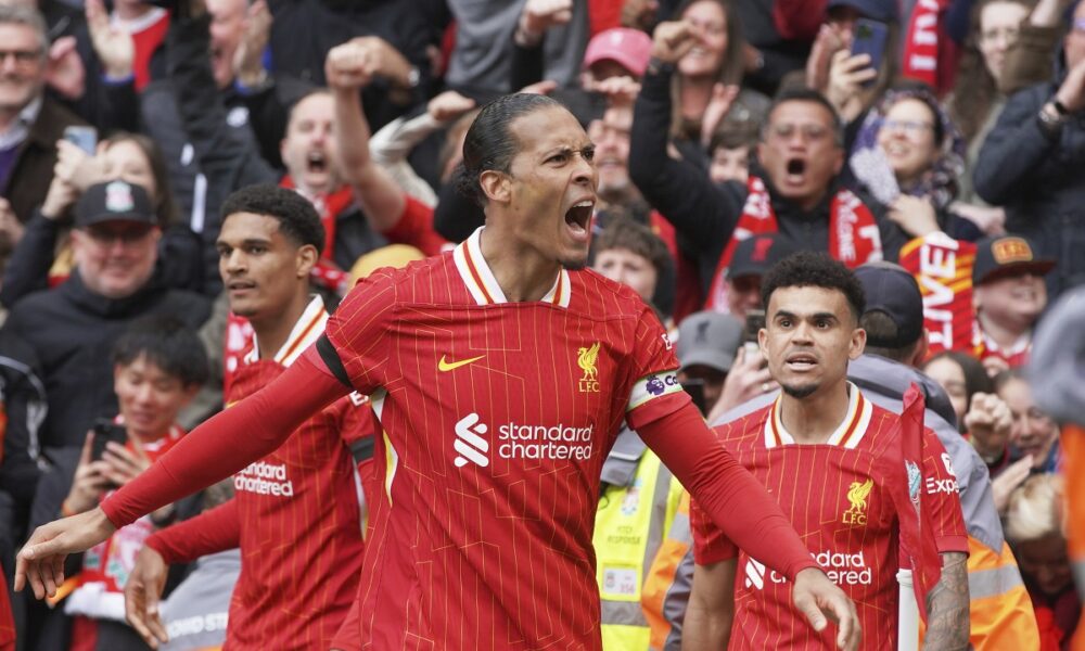 Liverpool's Virgil van Dijk celebrates after scoring his side's second goal during the English Premier League soccer match between Liverpool and West Ham United at Anfield in Liverpool, Sunday, April 13, 2025. (AP Photo/Ian Hodgson)