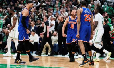 Knicks Celtics Basketball New York Knicks guard Jalen Brunson (11) celebrates after a win with teammates as Boston Celtics' Jrue Holiday, right, and Jaylen Brown, back left, walk off the court following Game 1 of an NBA basketball second-round playoff series Monday, May 5, 2025, in Boston. (AP Photo/Charles Krupa)