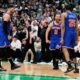 Knicks Celtics Basketball New York Knicks guard Jalen Brunson (11) celebrates after a win with teammates as Boston Celtics' Jrue Holiday, right, and Jaylen Brown, back left, walk off the court following Game 1 of an NBA basketball second-round playoff series Monday, May 5, 2025, in Boston. (AP Photo/Charles Krupa)