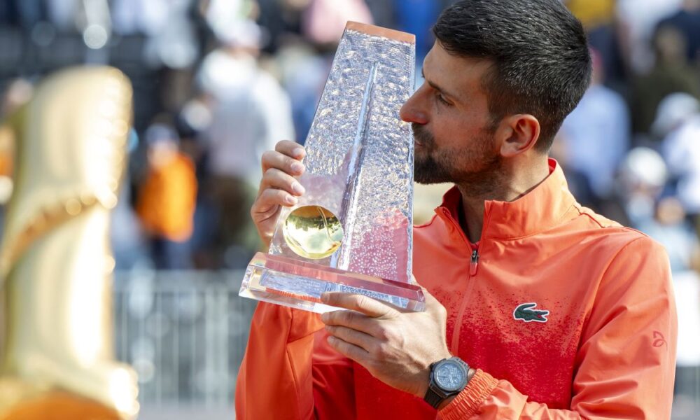 Winner Novak Djokovic of Serbia poses with the trophy after the final match of the ATP 250 Geneva Open tennis against Hubert Hurkacz of Poland, in Geneva, Switzerland, Saturday, May 24, 2025. (Martial Trezzini/Keystone via AP)