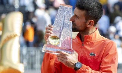 Winner Novak Djokovic of Serbia poses with the trophy after the final match of the ATP 250 Geneva Open tennis against Hubert Hurkacz of Poland, in Geneva, Switzerland, Saturday, May 24, 2025. (Martial Trezzini/Keystone via AP)