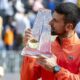 Winner Novak Djokovic of Serbia poses with the trophy after the final match of the ATP 250 Geneva Open tennis against Hubert Hurkacz of Poland, in Geneva, Switzerland, Saturday, May 24, 2025. (Martial Trezzini/Keystone via AP)