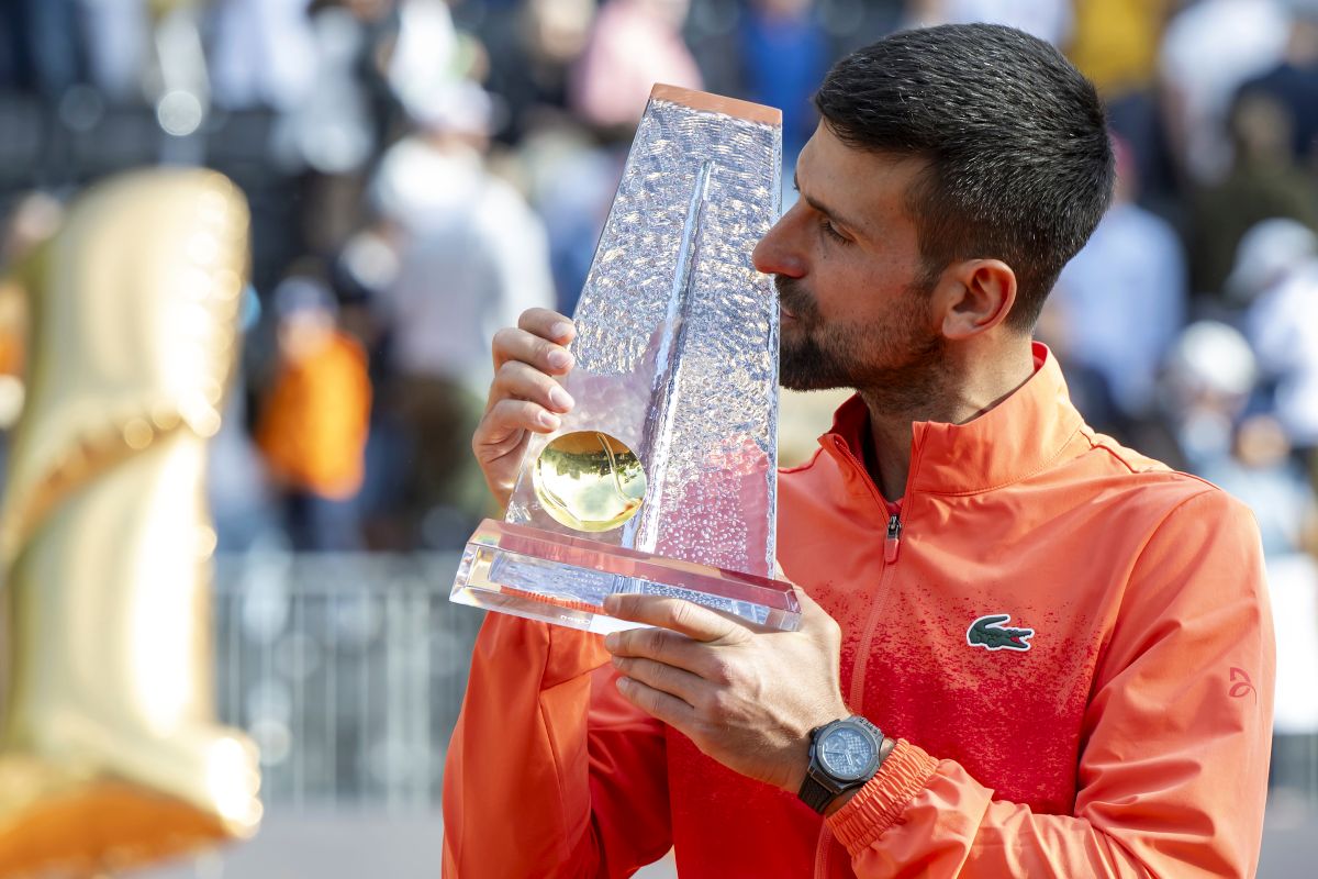 Winner Novak Djokovic of Serbia poses with the trophy after the final match of the ATP 250 Geneva Open tennis against Hubert Hurkacz of Poland, in Geneva, Switzerland, Saturday, May 24, 2025. (Martial Trezzini/Keystone via AP)