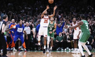 New York Knicks forward Mikal Bridges (25) takes the last shot of the game, after his game-winning steal against Boston Celtics forward Jayson Tatum (0) in the final seconds of the second half of Game 2 of an NBA basketball second-round playoff series, Wednesday, May 7, 2025, in Boston. (AP Photo/Charles Krupa)