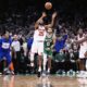 New York Knicks forward Mikal Bridges (25) takes the last shot of the game, after his game-winning steal against Boston Celtics forward Jayson Tatum (0) in the final seconds of the second half of Game 2 of an NBA basketball second-round playoff series, Wednesday, May 7, 2025, in Boston. (AP Photo/Charles Krupa)