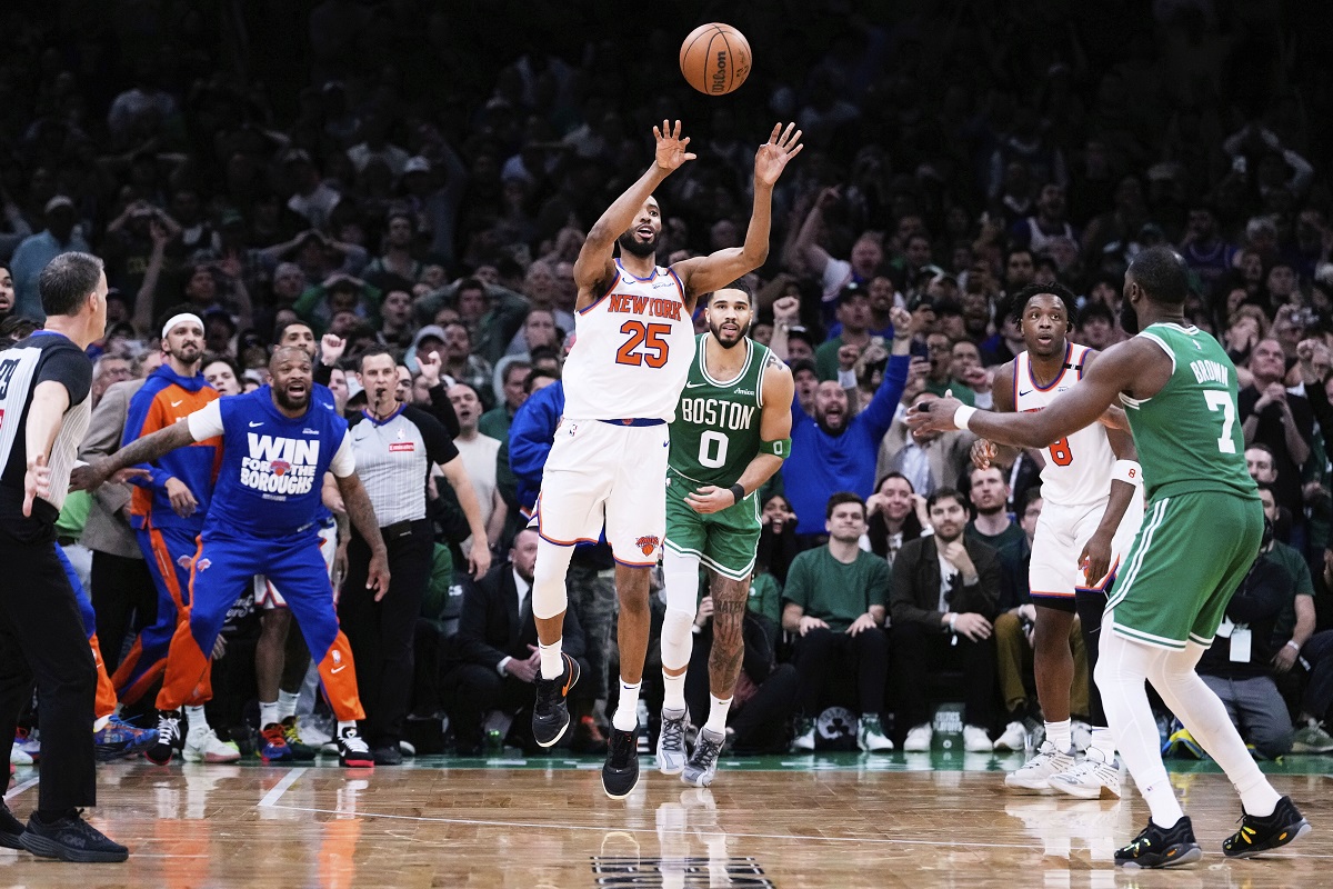 New York Knicks forward Mikal Bridges (25) takes the last shot of the game, after his game-winning steal against Boston Celtics forward Jayson Tatum (0) in the final seconds of the second half of Game 2 of an NBA basketball second-round playoff series, Wednesday, May 7, 2025, in Boston. (AP Photo/Charles Krupa)
