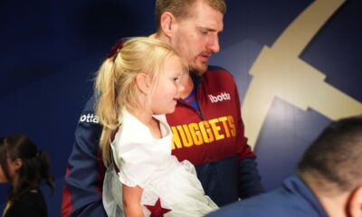 Denver Nuggets center Nikola Jokic holds his daughter after Game 7 of an NBA basketball first-round playoff series against the Los Angeles Clippers, Saturday, May 3, 2025, in Denver. (AP Photo/David Zalubowski)