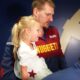 Denver Nuggets center Nikola Jokic holds his daughter after Game 7 of an NBA basketball first-round playoff series against the Los Angeles Clippers, Saturday, May 3, 2025, in Denver. (AP Photo/David Zalubowski)