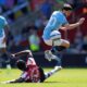 Southampton's Lesley Ugochukwu, bottom left, and Manchester City's Bernardo Silva battle for the ball during their Premier League soccer match at St Mary's Stadium, Southampton, England, Saturday May 10, 2025. (Andrew Matthews/PA via AP)