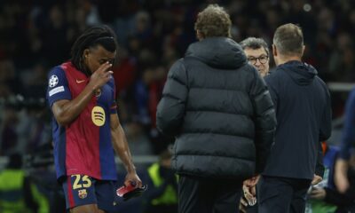 Barcelona's Jules Kounde walks off the pitch as he is being substituted due to injury during the Champions League semifinal first leg soccer match between Barcelona and Inter Milan at the Lluis Companys Olympic Stadium in Barcelona, Spain, Wednesday, April 30, 2025. (AP Photo/Joan Monfort)