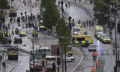 Police and emergency personnel deal with a road traffic accident on Water Street near the Liver Building in Liverpool after a car collided with pedestrians during the Premier League winners parade, in Liverpool, England, Monday May 26, 2025. (Danny Lawson/PA via AP)