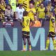 Dortmund's Serhou Guirassy, left, celebrates his after scoring with teammate Waldemar Anton during the German Bundesliga soccer match between Borussia Dortmund and Holstein Kiel at Signal Iduna Park in Dortmund, Germany, Saturday, May 17, 2025. (Bernd Thissen/dpa via AP)