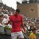 Serbia's Novak Djokovic holds a towel as he plays France's Corentin Moutet during their second round match of the French Tennis Open, at the Roland-Garros stadium, in Paris, Thursday, May 29, 2025. (AP Photo/Christophe Ena)