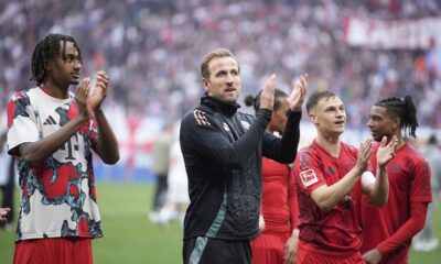Bayern's Harry Kane, centre, applauds supporters at the end of the German Bundesliga soccer match between RB Leipzig and FC Bayern Munich at the Red Bull Arena in Leipzig, Germany, Saturday, May 3, 2025. (AP Photo/Ebrahim Noroozi)