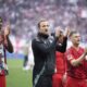 Bayern's Harry Kane, centre, applauds supporters at the end of the German Bundesliga soccer match between RB Leipzig and FC Bayern Munich at the Red Bull Arena in Leipzig, Germany, Saturday, May 3, 2025. (AP Photo/Ebrahim Noroozi)