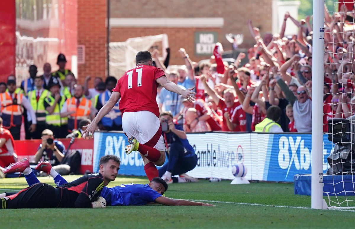 Nottingham Forest's Chris Wood, right, celebrates after scoring during a Premier League soccer match against Leicester City at City Ground in Nottingham, England, Sunday May 11, 2025. (Jacob King/PA via AP)