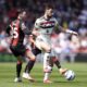 Manchester United's Bruno Fernandes, right, and Bournemouth's Adam Smith battle for the ball during the English Premier League match at Vitality Stadium, Bournemouth, England, Sunday, April 27, 2025. (Adam Davy/PA via AP)