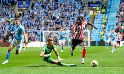 Sunderland's Eliezer Mayenda, right, gets set to score their side's second goal of the game against Coventry City during the Sky Bet Championship playoff semifinal, first leg soccer match at the Coventry Building Society Arena in Coventry, England, Friday, May 9, 2025. (Nick Potts/PA via AP)