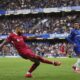Liverpool's Mohamed Salah passes the ball during the English Premier League soccer match between Chelsea and Liverpool at Stamford Bridge stadium in London, Sunday, May 4, 2025. (AP Photo/Kin Cheung)
