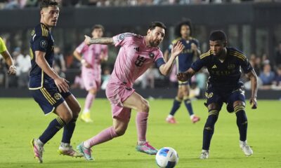 Inter Miami forward Lionel Messi, center, controls the ball during the second half of a CONCACAF Champions Cup second-leg semifinal soccer match against the Vancouver Whitecaps, Wednesday, April 30, 2025, in Fort Lauderdale, Fla. (AP Photo/Lynne Sladky)