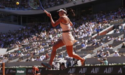 Serbia's Olga Danilovic returns the ball to Aryna Sabalenka of Belarus during their third round match of the French Tennis Open, at the Roland-Garros stadium, in Paris, Friday, May 30, 2025. (AP Photo/Lindsey Wasson)