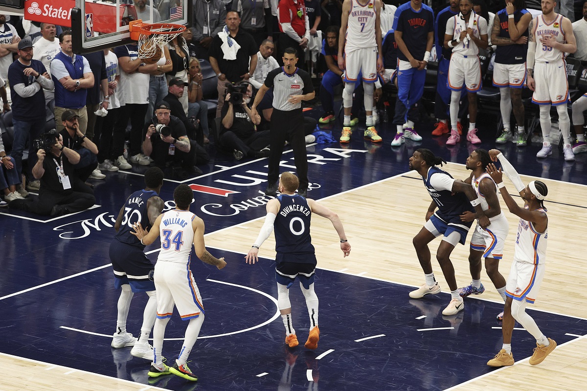 Oklahoma City Thunder guard Shai Gilgeous-Alexander, right, makes a free throw during the second half of Game 4 of the Western Conference finals of the NBA basketball playoffs against the Minnesota Timberwolves Monday, May 26, 2025, in Minneapolis. (AP Photo/Matt Krohn)