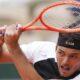 Taylor Fritz of the U.S. returns the ball to Germany's Daniel Altmaier during their first round match of the French Tennis Open, at the Roland-Garros stadium, in Paris, Monday, May 26, 2025. (AP Photo/Lindsey Wasson)