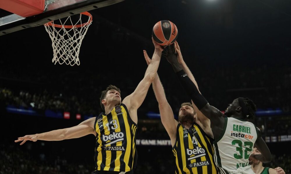 Fenerbahce's Tarik Biberovic, left, and Fenerbahce's Nicolo Melli rebaund with Panathinaikos's Wenyen Gabriel duirng the Euroleague seimifinal basketball match between Fenerbahce and Panathinaikos in Abu Dhabi, United Arab Emirates, Sunday, May 18, 2025. (AP Photo/Fatima Shbair)
