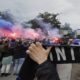 Inter Milan fans let off flares as a bus carrying Inter Milan players arrives ahead of the Champions League semifinal second leg soccer match between Inter Milan and Barcelona at San Siro stadium in Milan , Italy, Tuesday, May 6, 2025. (AP Photo/Luca Bruno)
