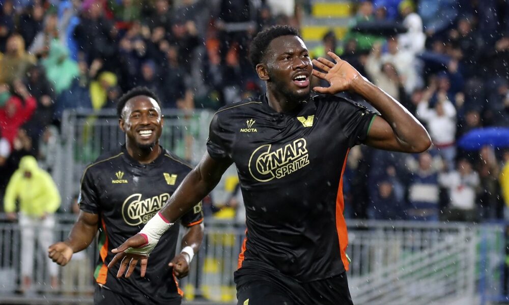 Venezia's Fali Cande celebrates after scoring the opening goal during the Serie A soccer match between Venezia and Fiorentina in Venice, Italy, Monday, May 12, 2025. (Paola Garbuio/LaPresse via AP)