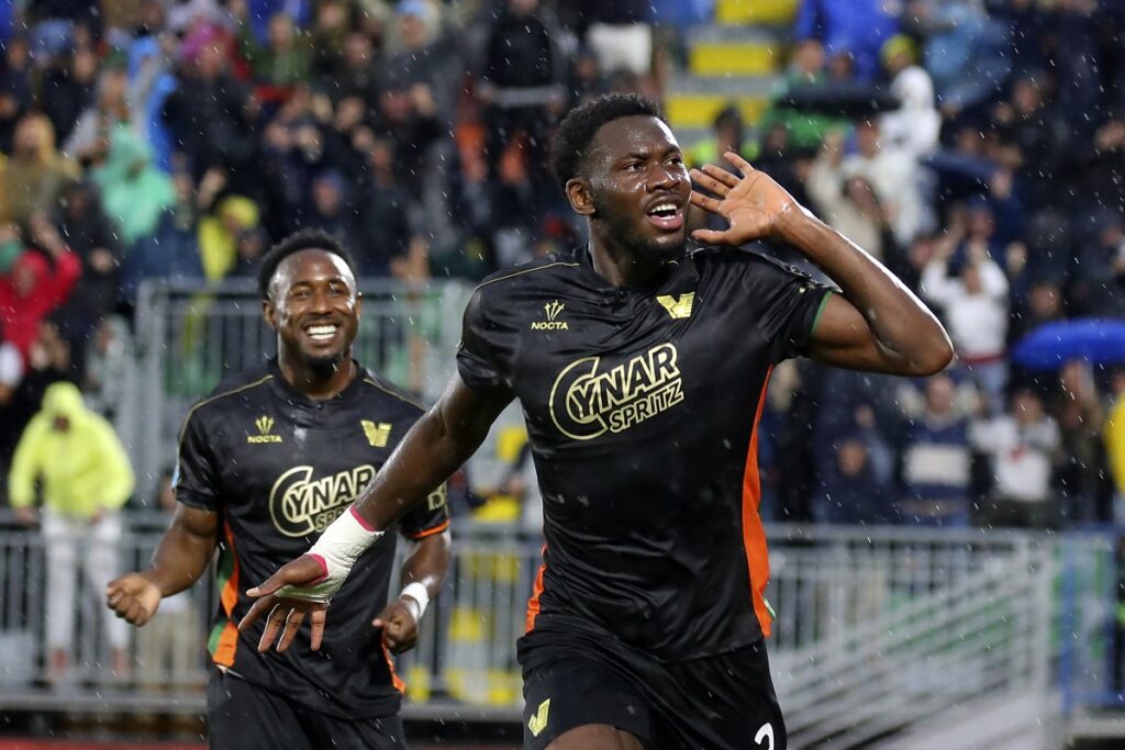 Venezia's Fali Cande celebrates after scoring the opening goal during the Serie A soccer match between Venezia and Fiorentina in Venice, Italy, Monday, May 12, 2025. (Paola Garbuio/LaPresse via AP)