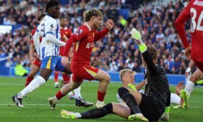 Liverpool's Harvey Elliott, centre, scores his side's opening goal during the English Premier League soccer match between Brighton and Liverpool at American Express Stadium in Brighton, England, Monday, May 19, 2025. (AP Photo/Ian Walton)