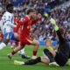 Liverpool's Harvey Elliott, centre, scores his side's opening goal during the English Premier League soccer match between Brighton and Liverpool at American Express Stadium in Brighton, England, Monday, May 19, 2025. (AP Photo/Ian Walton)