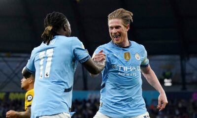 Manchester City's Kevin De Bruyne, right, celebrates scoring with teammate Jeremy Doku during the English Premier League soccer match between Manchester City and Wolverhampton Wanderers at Etihad Stadium, Manchester, England, Friday May 2, 2025. (Martin Rickett/PA via AP)