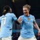 Manchester City's Kevin De Bruyne, right, celebrates scoring with teammate Jeremy Doku during the English Premier League soccer match between Manchester City and Wolverhampton Wanderers at Etihad Stadium, Manchester, England, Friday May 2, 2025. (Martin Rickett/PA via AP)