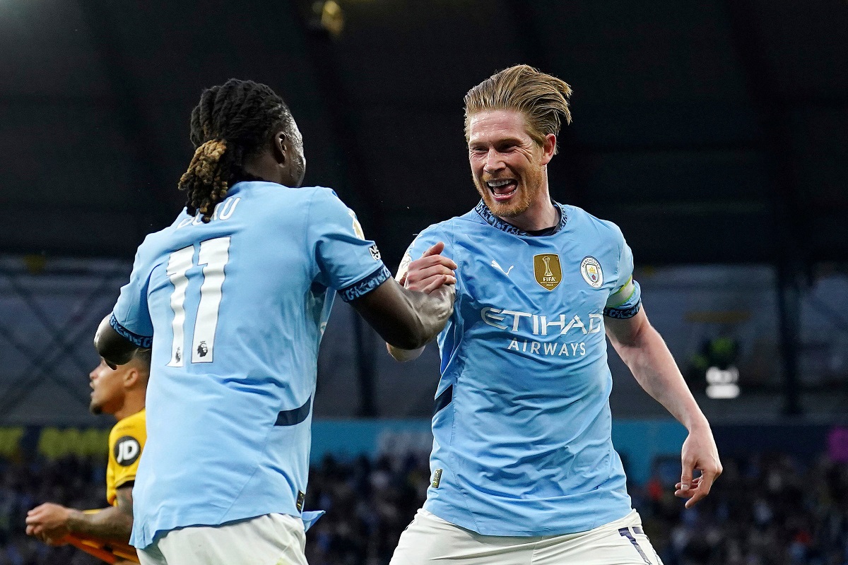 Manchester City's Kevin De Bruyne, right, celebrates scoring with teammate Jeremy Doku during the English Premier League soccer match between Manchester City and Wolverhampton Wanderers at Etihad Stadium, Manchester, England, Friday May 2, 2025. (Martin Rickett/PA via AP)