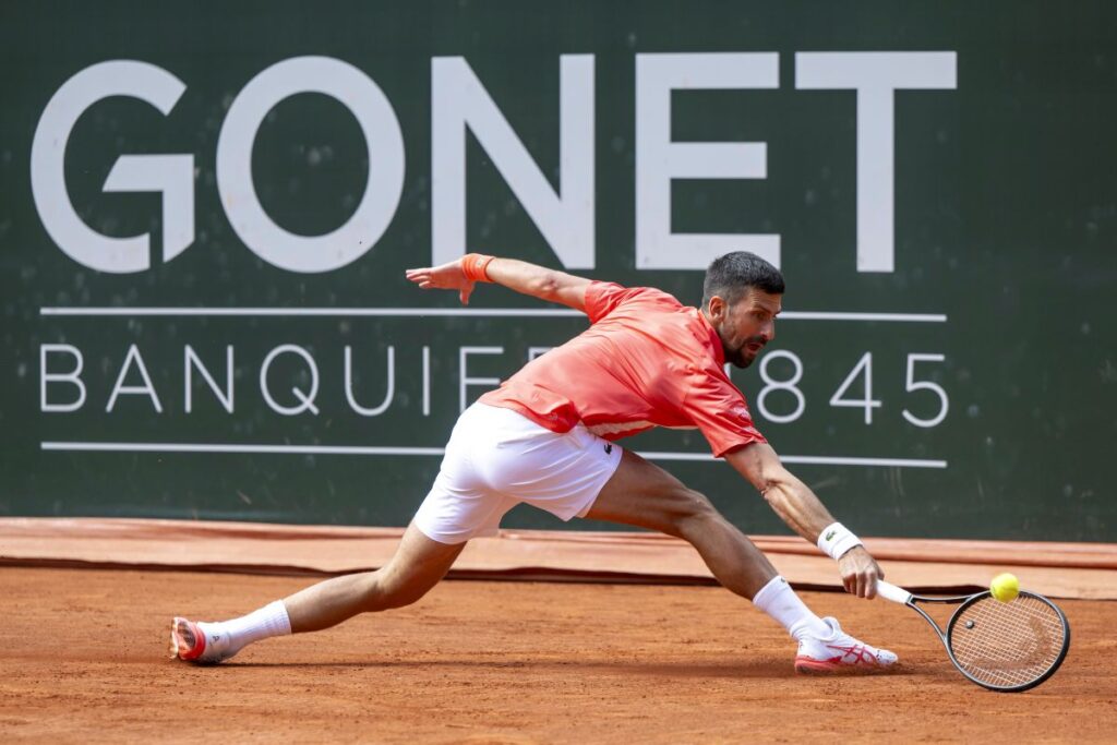 Novak Djokovic of Serbia returns a ball to Cameron Norrie of Britain, during their semi-final match, at the ATP 250 Geneva Open tournament in Geneva, Switzerland, Friday, May 23, 2025. (Martial Trezzini/Keystone via AP)