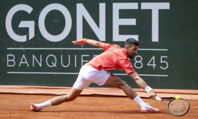 Novak Djokovic of Serbia returns a ball to Cameron Norrie of Britain, during their semi-final match, at the ATP 250 Geneva Open tournament in Geneva, Switzerland, Friday, May 23, 2025. (Martial Trezzini/Keystone via AP)