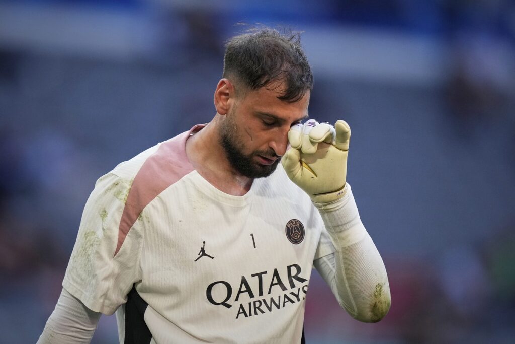 PSG's goalkeeper Gianluigi Donnarumma wipes his face during a training session ahead of the Champions League final soccer match between Paris Saint-Germain and Inter Milan at the Allianz Arena in Munich, Germany, Friday, May 30, 2025. (AP Photo/Matthias Schrader)